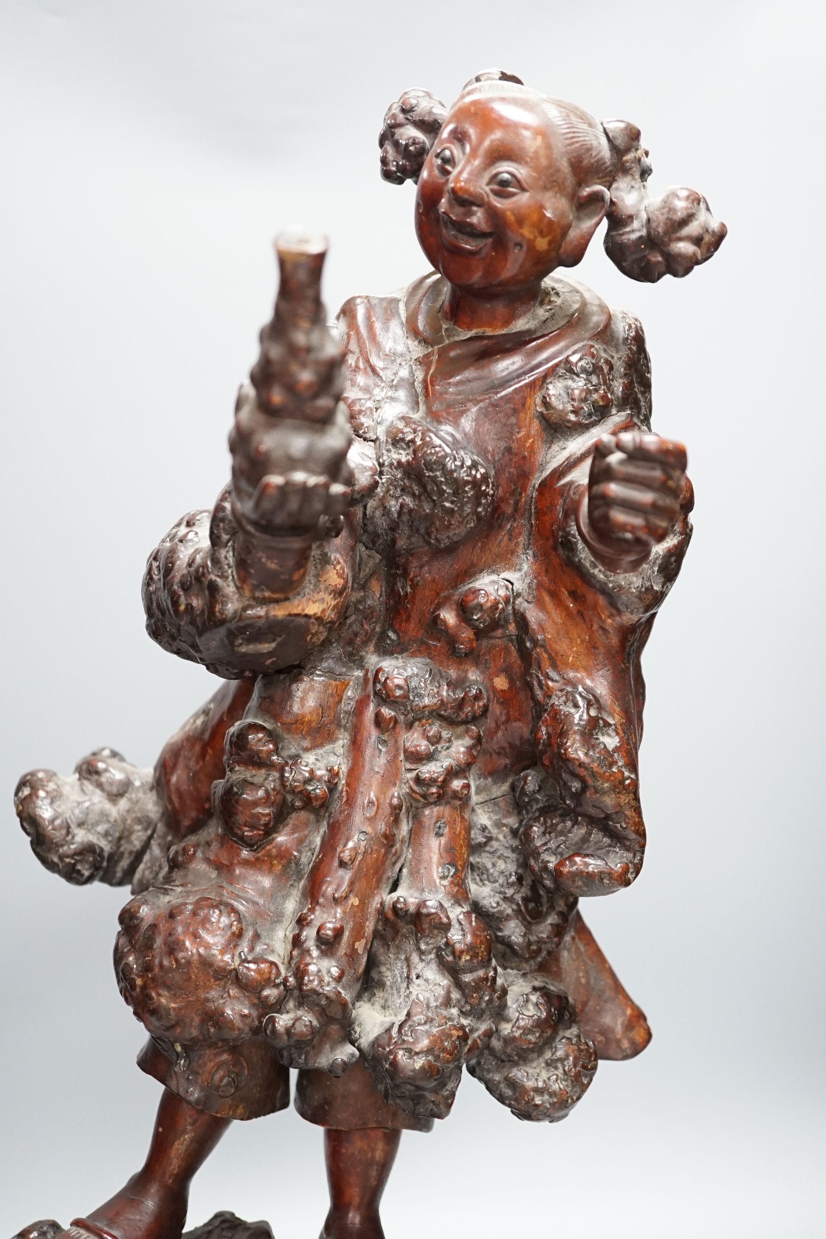 A Chinese root carving of a lady, 57cm